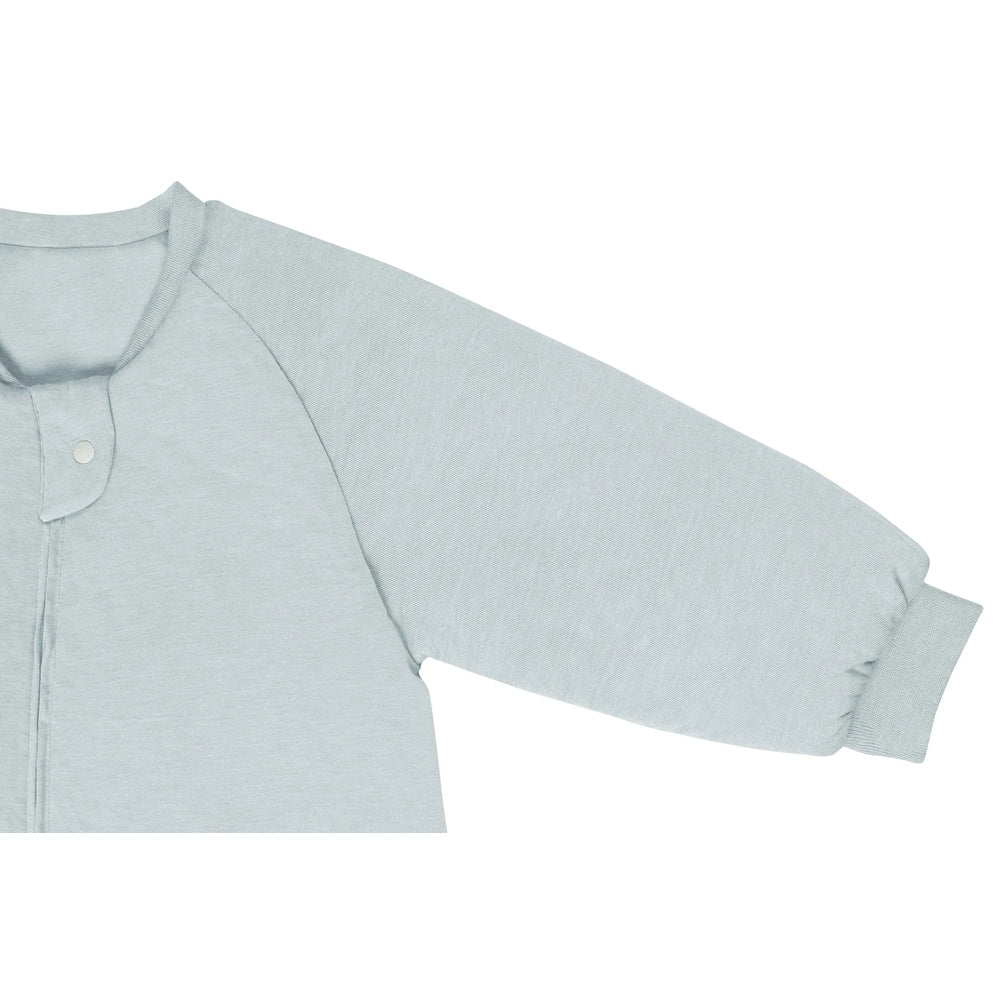 Nest Designs bamboo jersey long-sleeve sleep bag in Ice Flow blue, with snap front and footed legs.