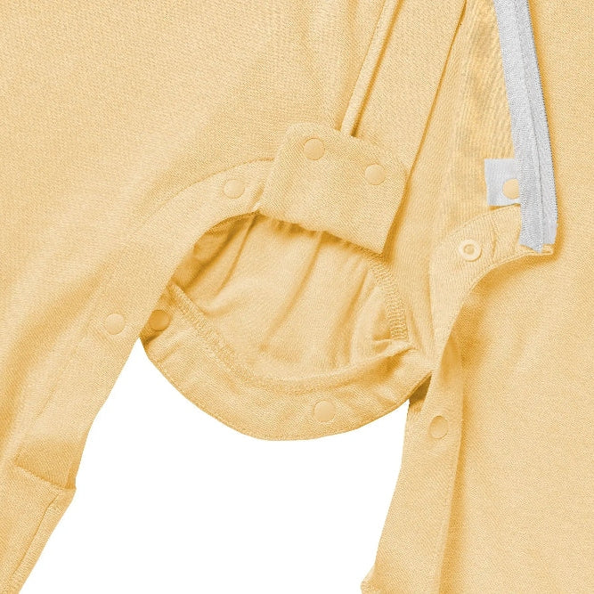 Nest Designs bamboo jersey short-sleeve footed sleep bag Pantone Sunset Gold, with snap closures at leg openings.