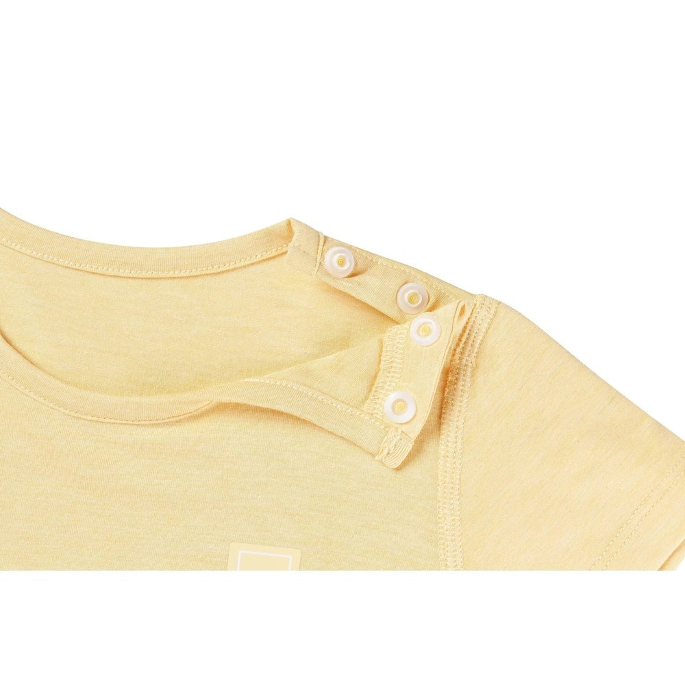Nest Designs Bamboo Jersey Short Sleeve T-Shirt Pantone Sunset Gold, pale yellow knit showing three shoulder snaps fastening the placket
