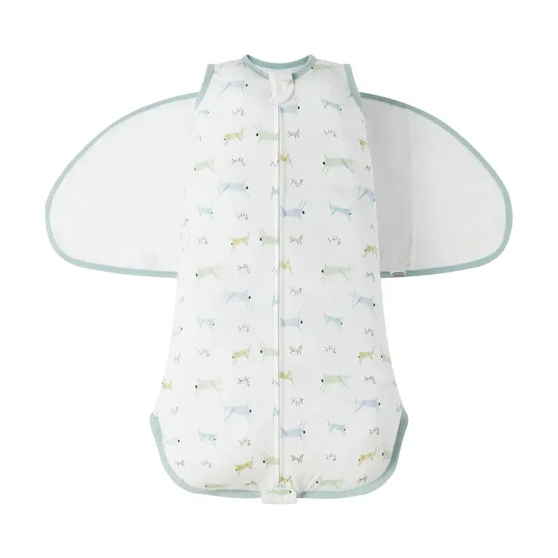 Nest Designs Bamboo Jersey Swaddle Sleep Bag 0.25 tog The Ant & The Grasshopper 0-6M in white with mint trim, winged side panels spread open.