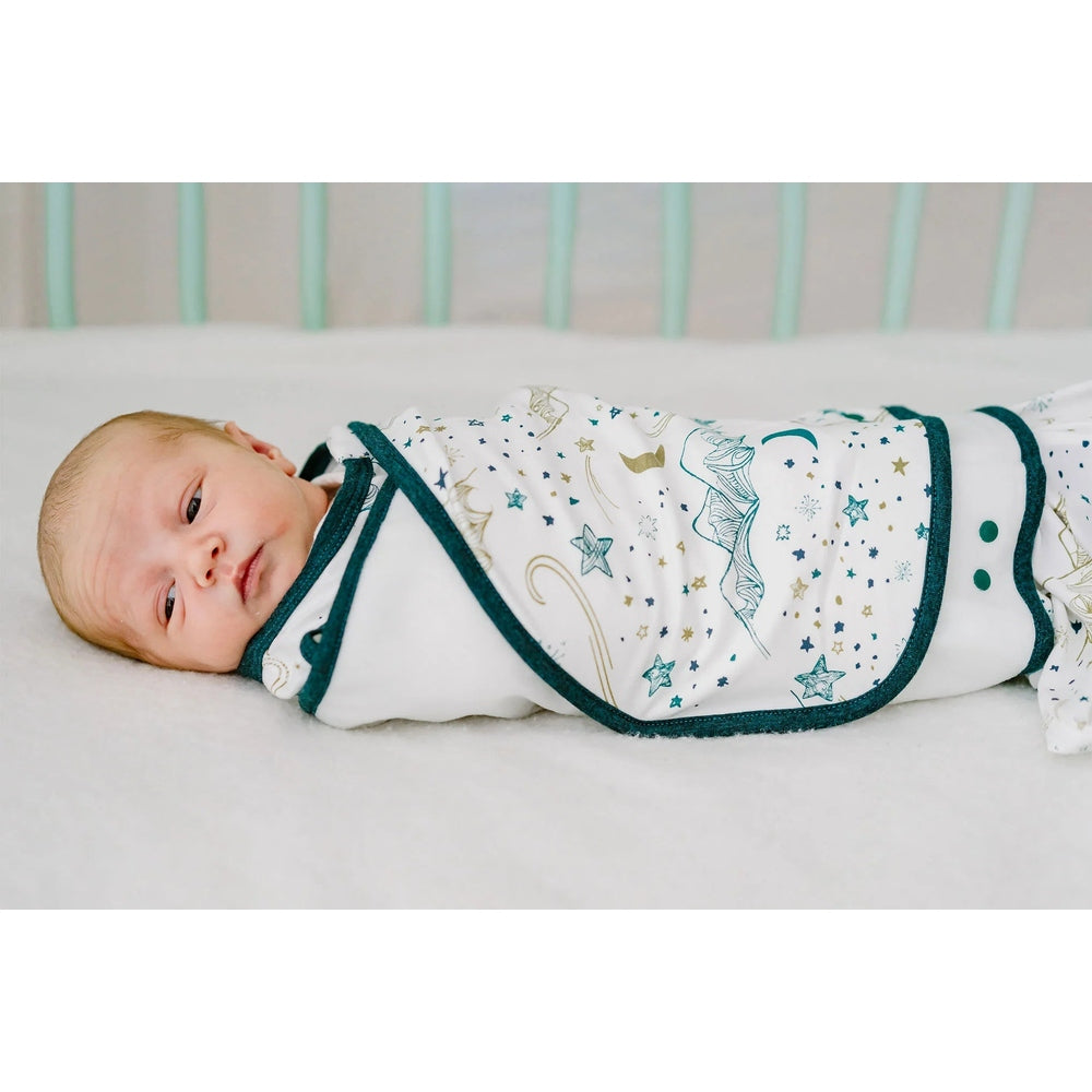Nest Designs bamboo jersey swaddle sleep bag in white with teal trim and star pattern, 0–6M