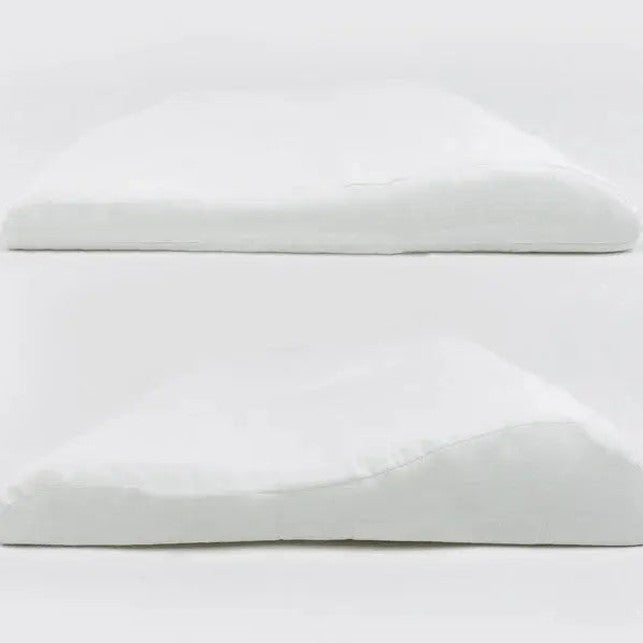 Nest Designs bamboo jersey toddler pillow and pillowcase set in white giraffe shapes, two flat pillows resting on a clean surface