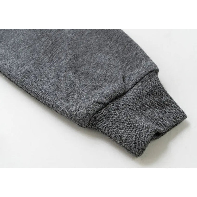 Nest Designs bamboo long-sleeve footed sleep bag Lets Roll gray fabric cuff close-up, soft knit