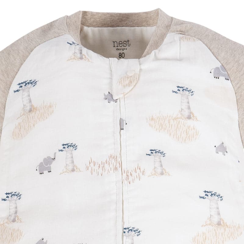 Nest Designs Bamboo Long Sleeve Footed Sleep Bag in ivory with baobab print, front-zip opening.