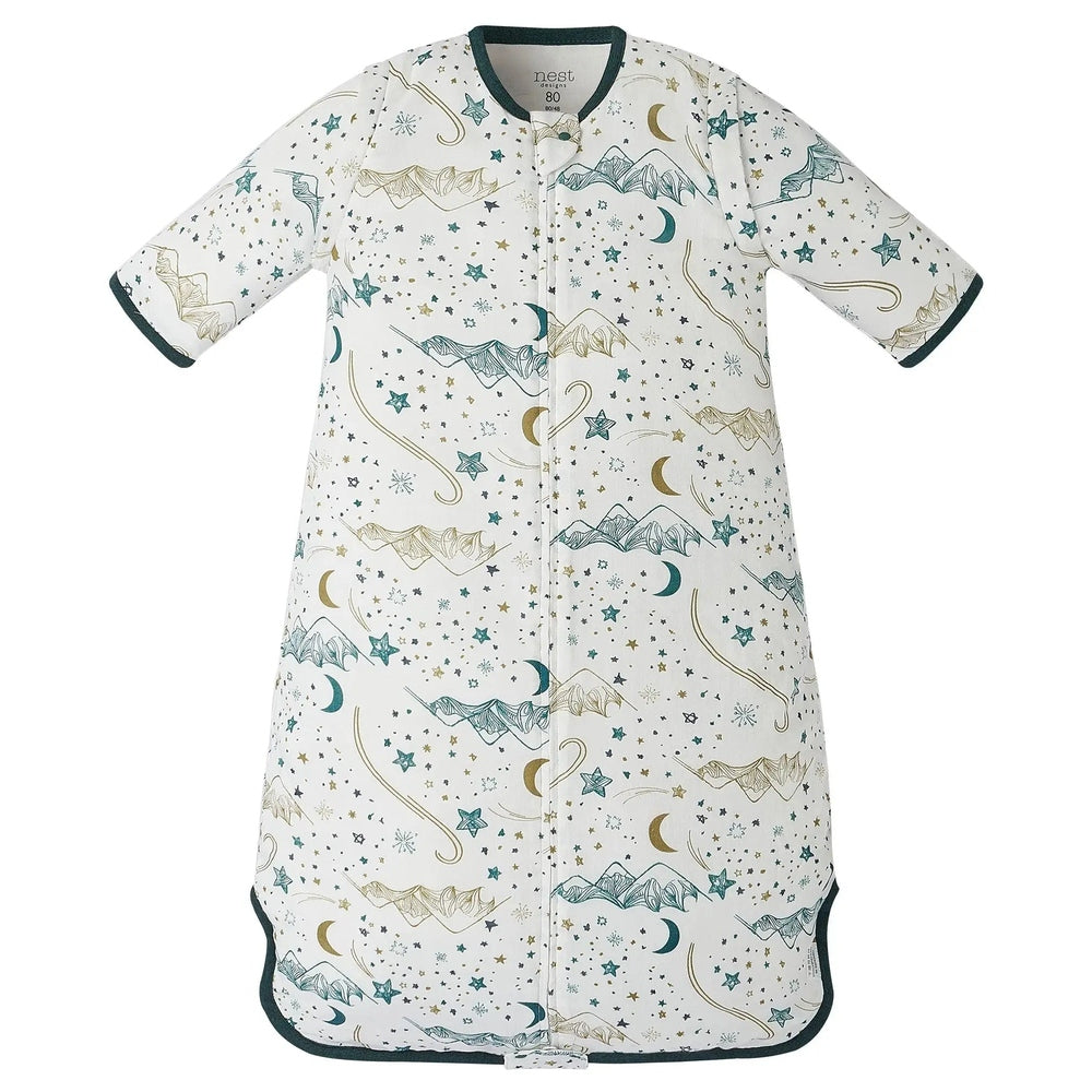 Nest Designs Bamboo Muslin Removable 3/4 Sleeve Sleep Bag in white with teal stars, laid flat showing removable sleeves and teal trim