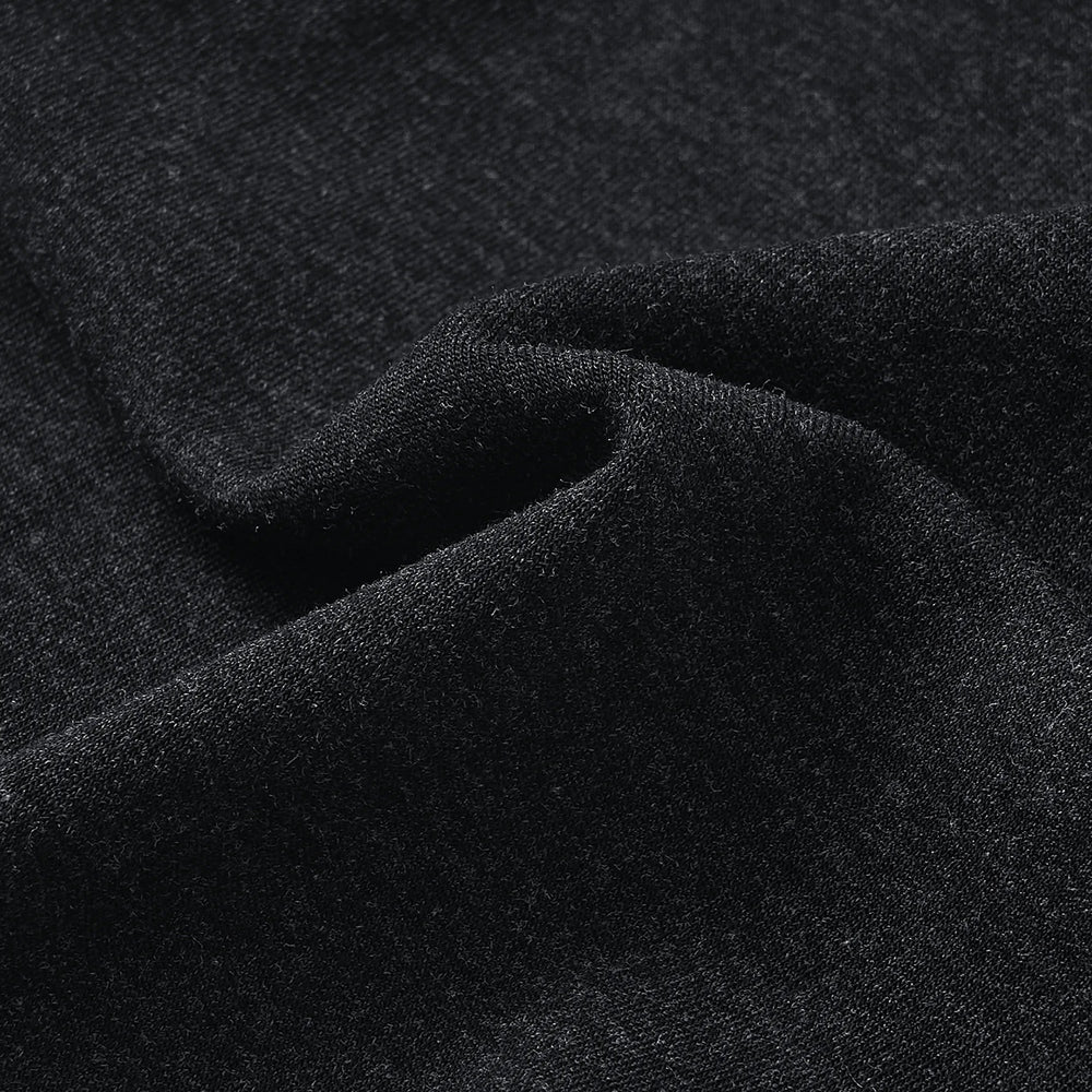 Black bamboo-blend maternity leggings fabric close-up, soft knit texture.