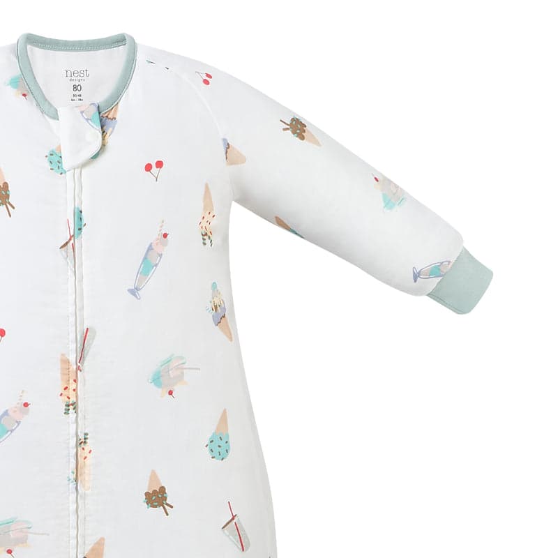 Nest Designs Bamboo Pima Long Sleeve Footed Sleep Bag 0.6 Tog in white ice cream print, zipper closed