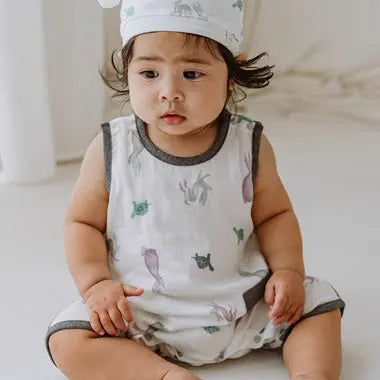 Nest Designs Bamboo Pima Sleeveless Romper The Tortoise & The Hare in gray; baby sits calmly, proving sleeveless, breathable comfort.