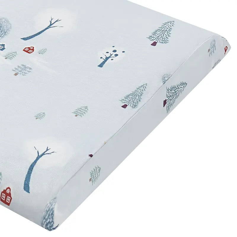Nest Designs Bamboo Toddler Pillow with Pillowcase Snowy Snuggles, white fabric printed with blue trees.