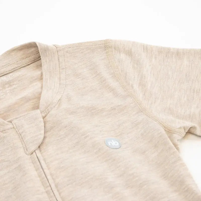 Nest Designs Basics Bamboo Cotton Short Sleeve Drop Bottom Romper in warm taupe, laid flat to show soft knit and drop-bottom opening.