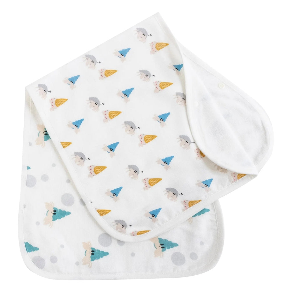 Nest Designs Burp'N Bib 2-Pack white burp cloths with teal trees and ice cream cone prints, folded together.