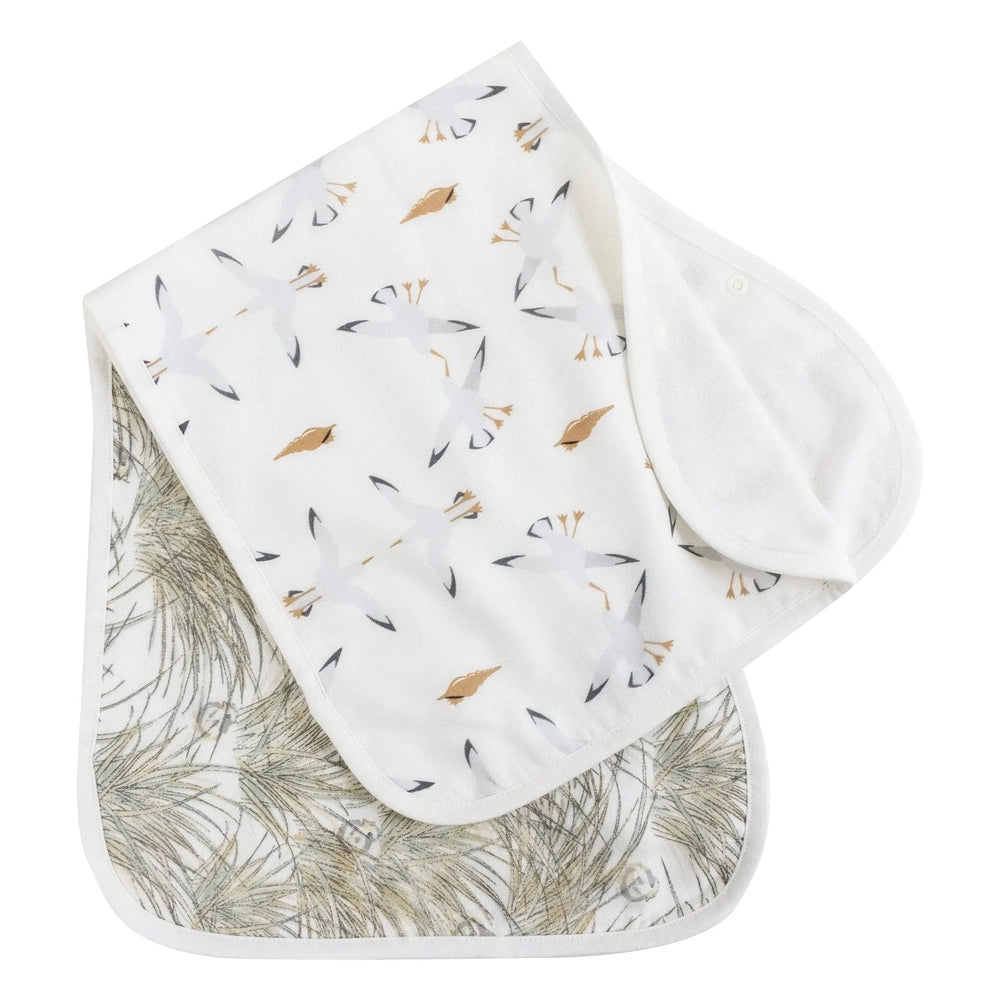Nest Designs Burp'N Bib 2-pack; white bibs with bird print and palm-leaf interior, snap closures