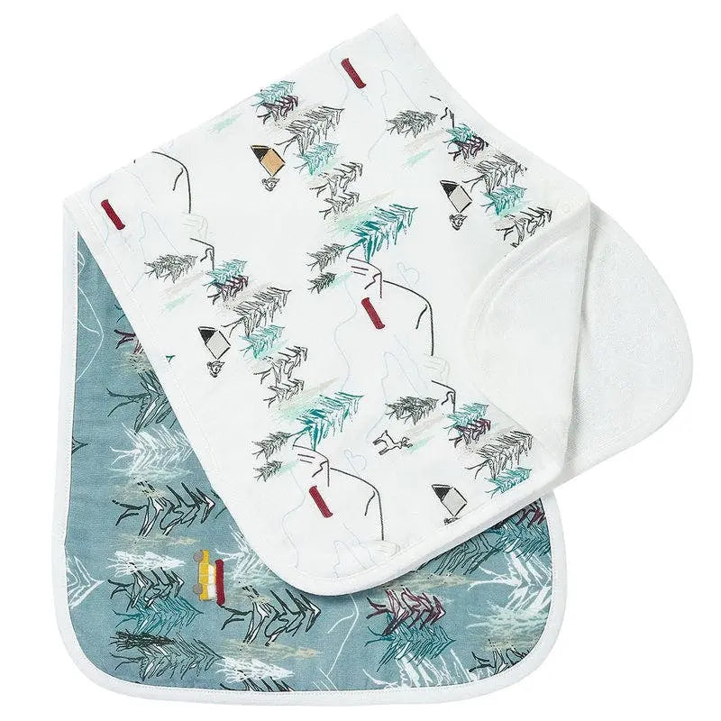 Nest Designs Burp'N Bib 2-pack; white and teal patterned baby bibs laid flat to show dual-layer protection.