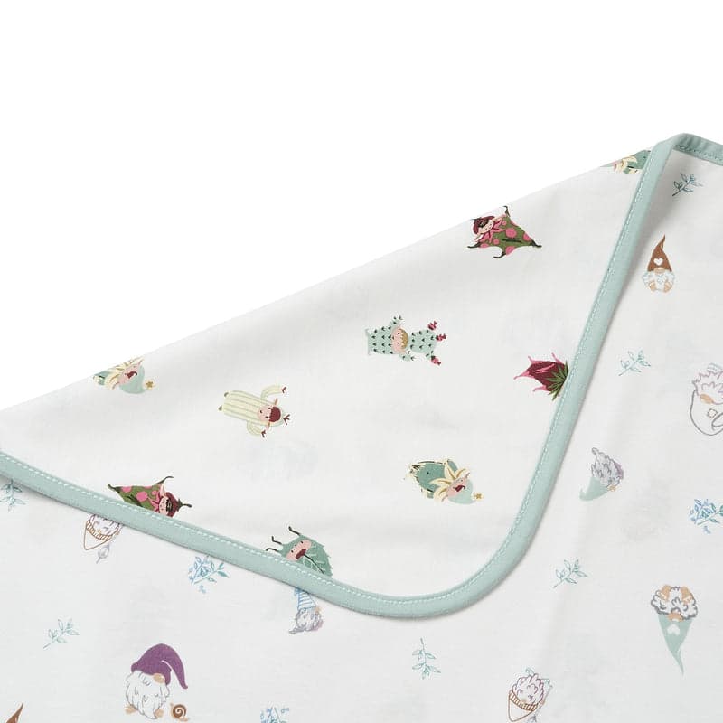 Nest Designs cotton waterproof change pad, Magic Mischief print in white with pastel characters and pale blue trim