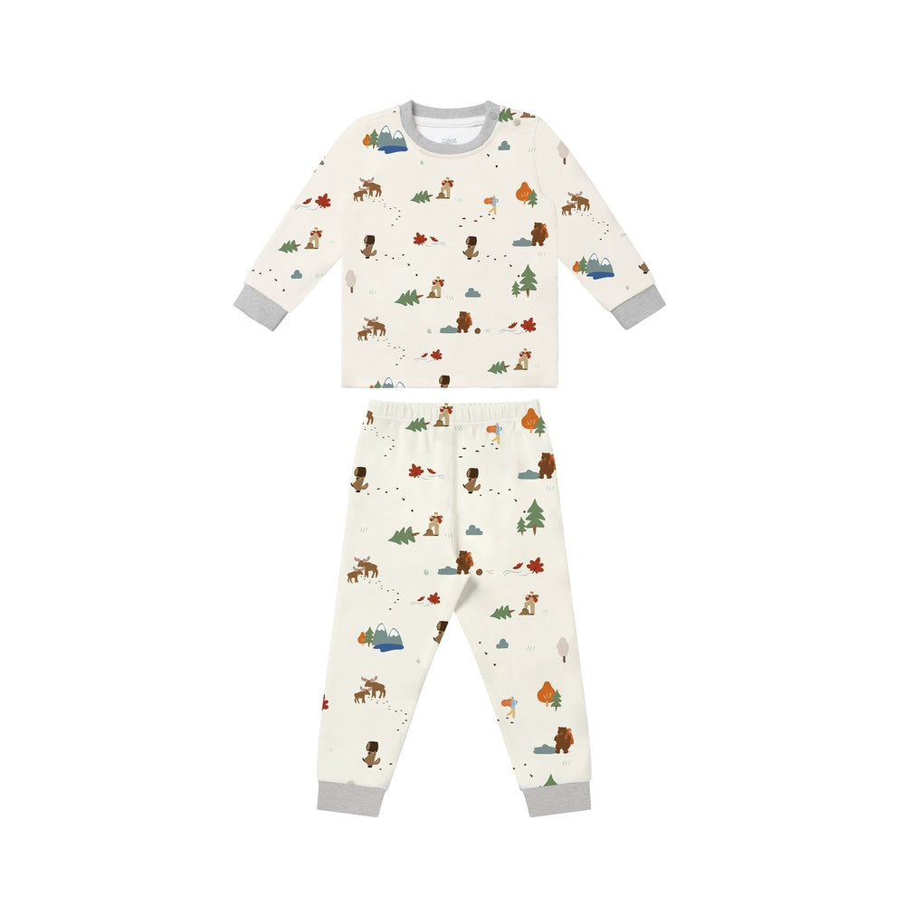 Nest Designs Long Sleeve Pj Set Timber, cream woodland-print two-piece sleepwear with gray cuffs, flat-lay.