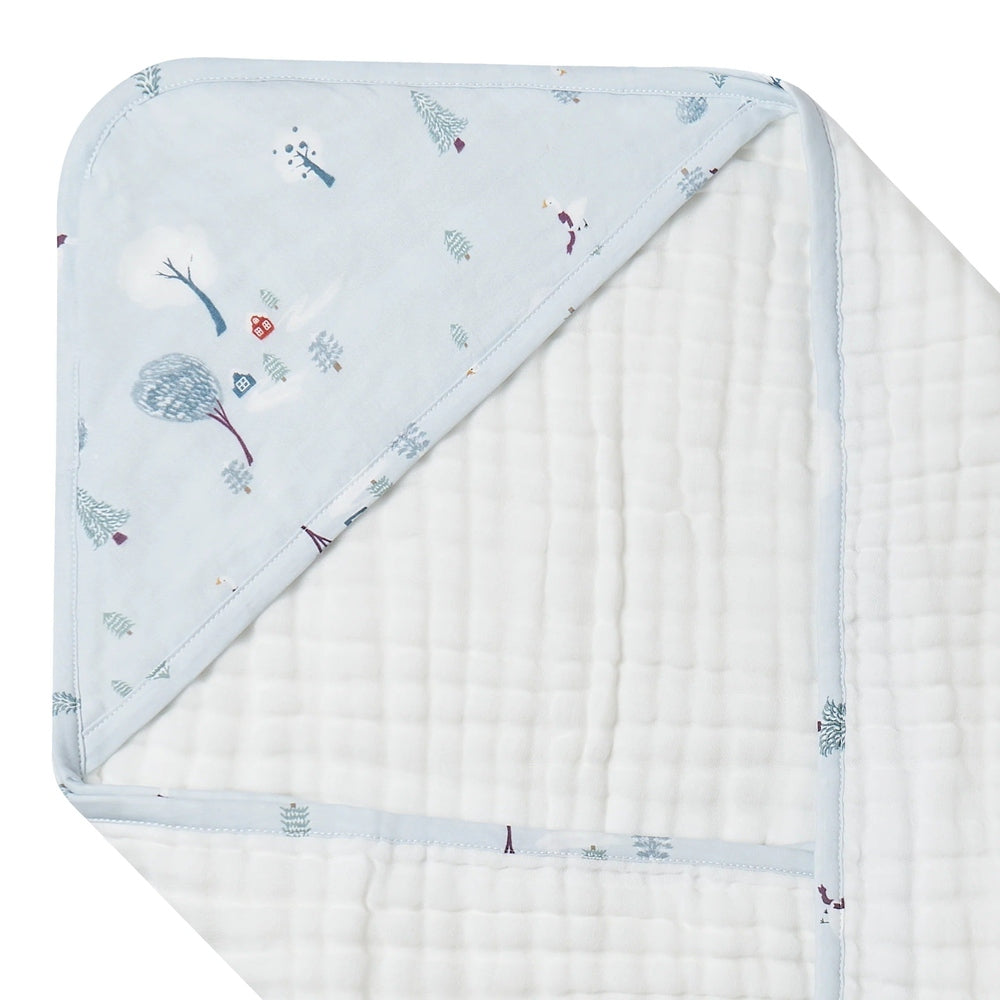 Nest Designs Organic Cotton 9-Layer Hooded Baby Bath Towel Snowy Snuggles in pale blue, baby snuggles under the hood.