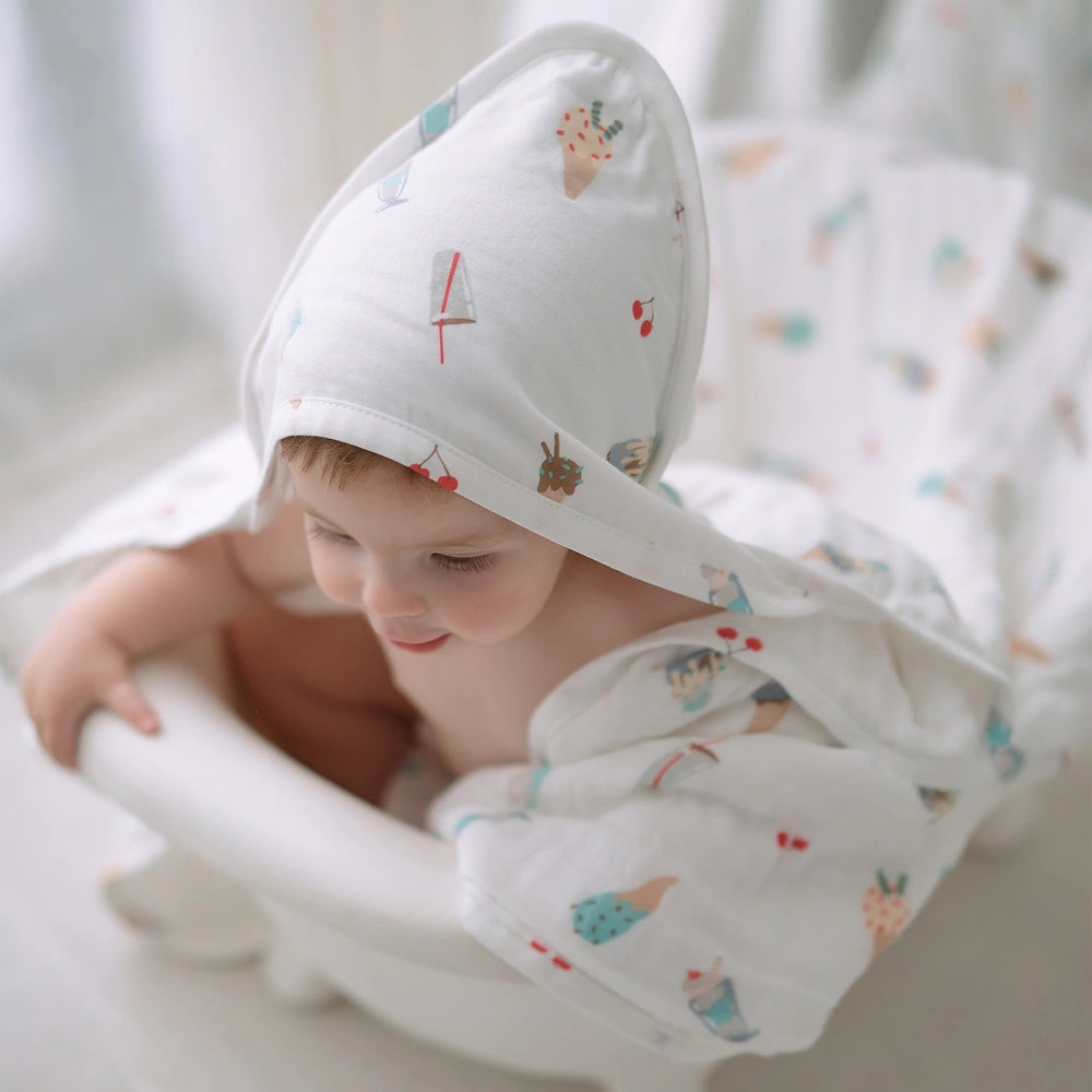 Nest Designs hooded baby bath towel in organic cotton, white with ice cream print, 9-layer hood