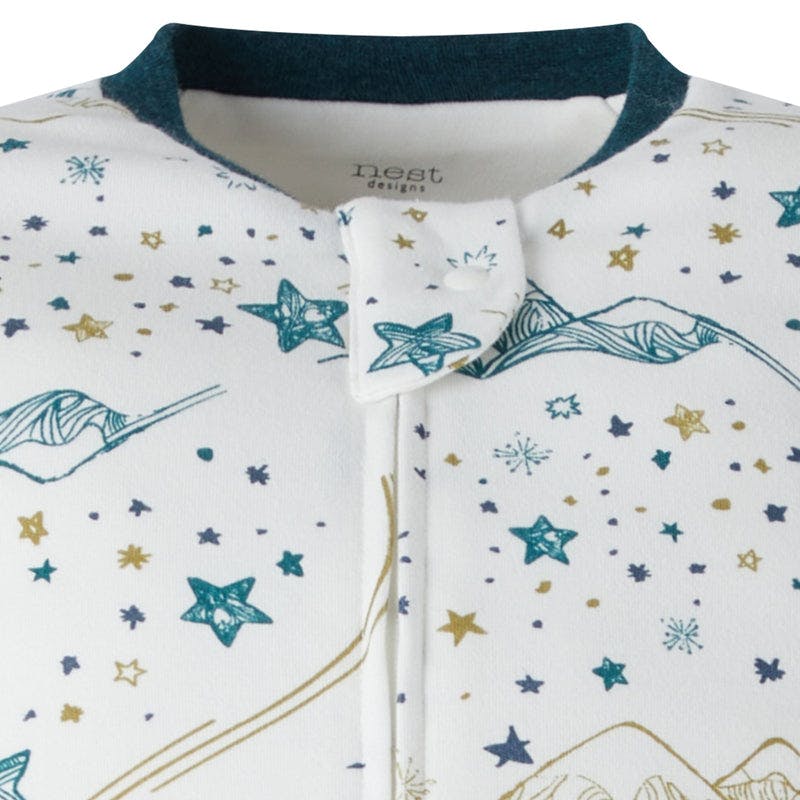 Nest Designs Organic Cotton Long Sleeve Footed Sleep Bag 1.0 Tog Stars White, white sleep sack with teal stars and mountains, front zipper.