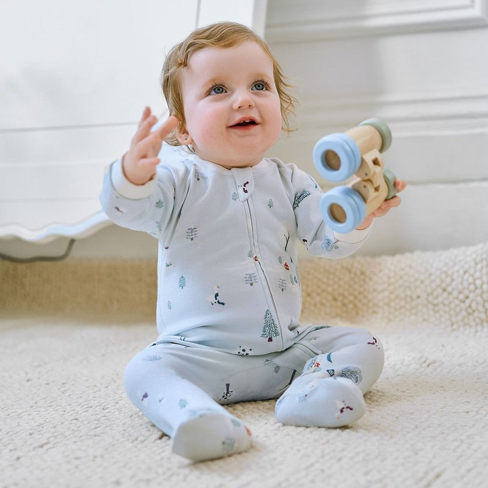 Nest Designs organic cotton long-sleeve footed sleep bag, 1.0 Tog, Snowy Snuggles; baby in pale blue sleeper