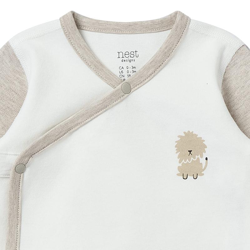 Nest Designs Organic Cotton Long Sleeve Kimono Onesie-Safawhee in white with beige trim, side-snap wrap, featuring a small lion graphic.
