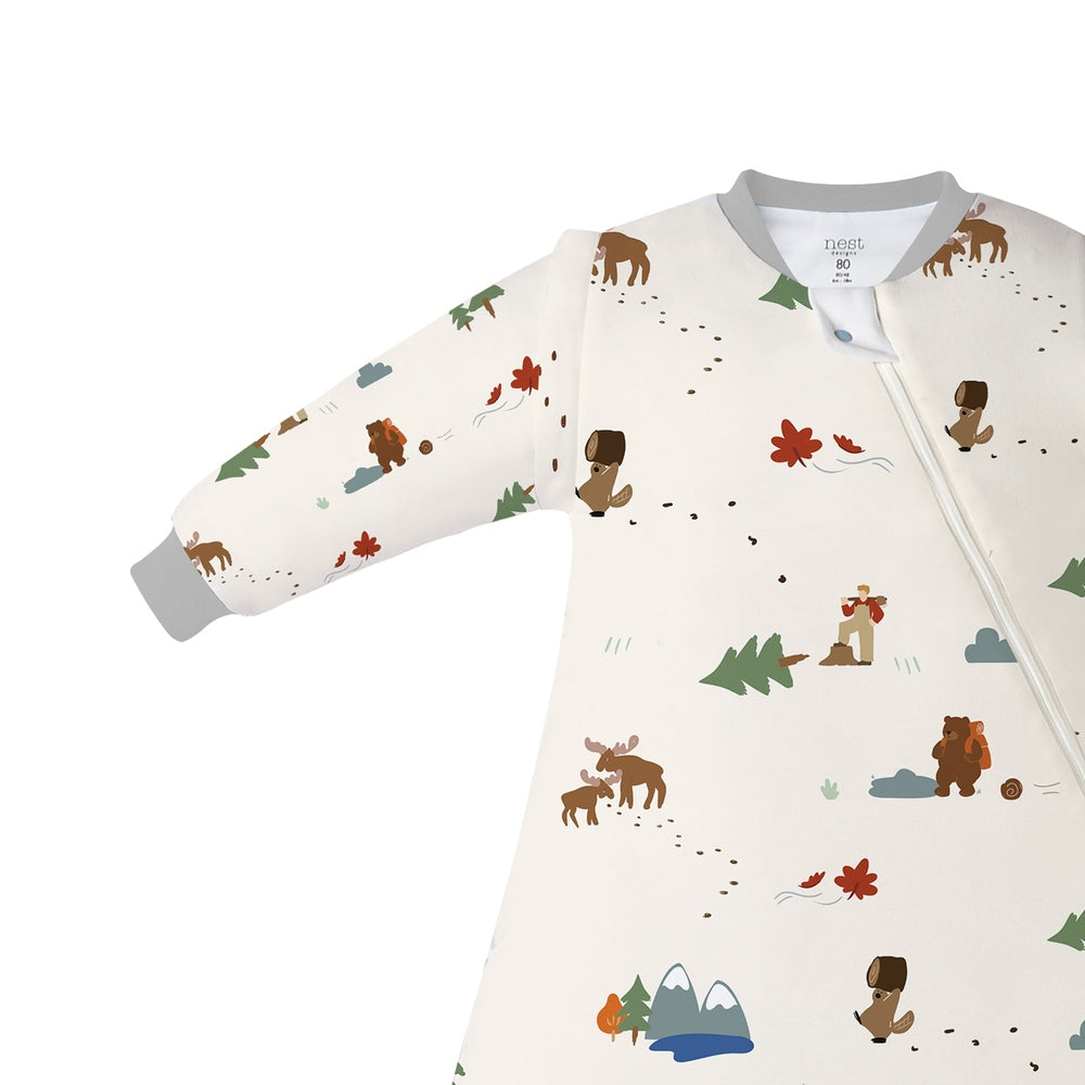 Nest Designs Organic Cotton Removable Sleeve Sleep Bag 1.0 Tog in cream with woodland animal print and front zipper.