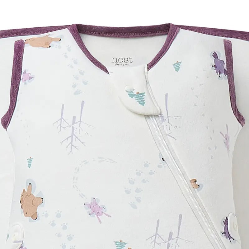 Nest Designs Organic Cotton Startle Stop Sleep Bag 0.5 Tog Snow Angels in white with purple trim and a diagonal zipper.