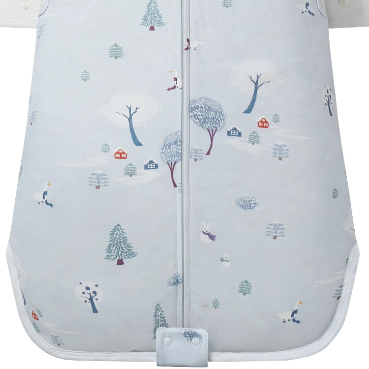 Nest Designs Organic Cotton Swaddle Sleep Bag 0.5 Tog Snowy Snuggles in pale blue with snowy trees and front zipper.