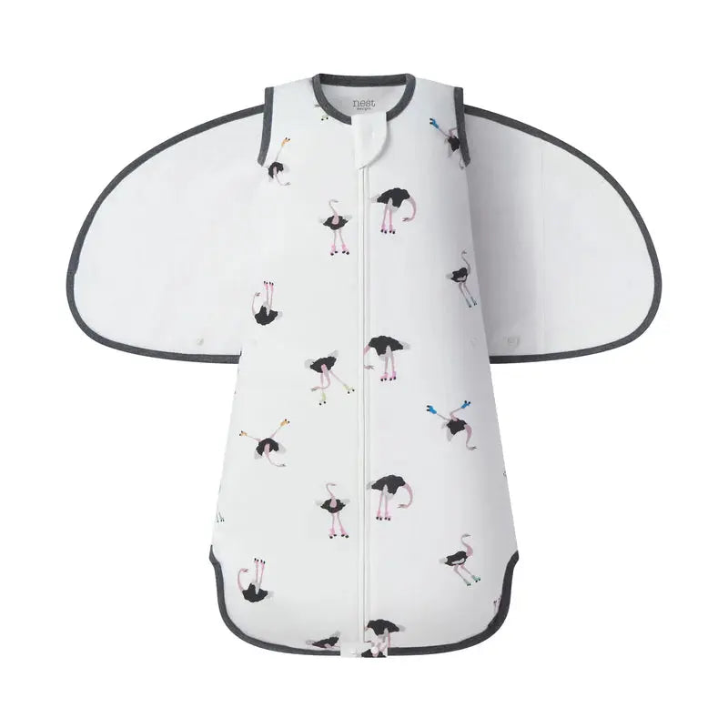 Nest Designs Swaddle Sleep Bag 1.0 Tog, white organic cotton with pink flamingos and grey trim, winged sides.