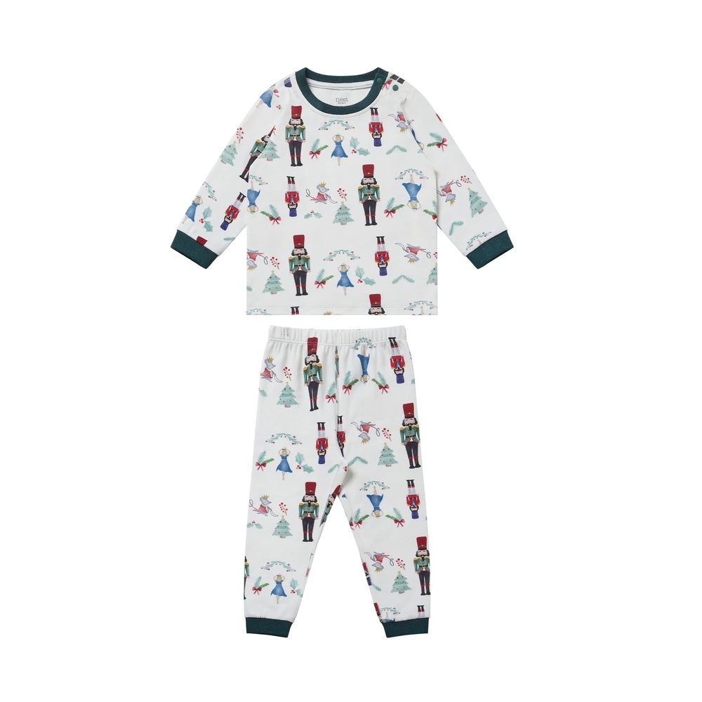 Nest Designs Organic Cotton Two-Piece Long Sleeve PJ Set Nutcracker laid flat, white with green cuffs and nutcracker print.