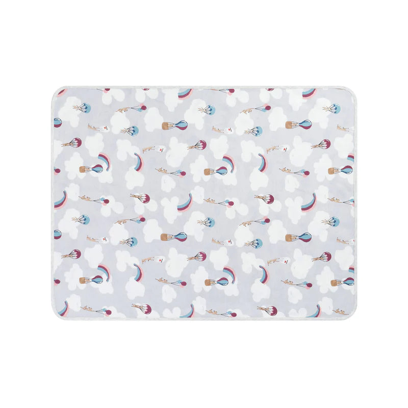 Nest Designs organic cotton waterproof change pad Sahara Sky pattern with clouds and parachutes