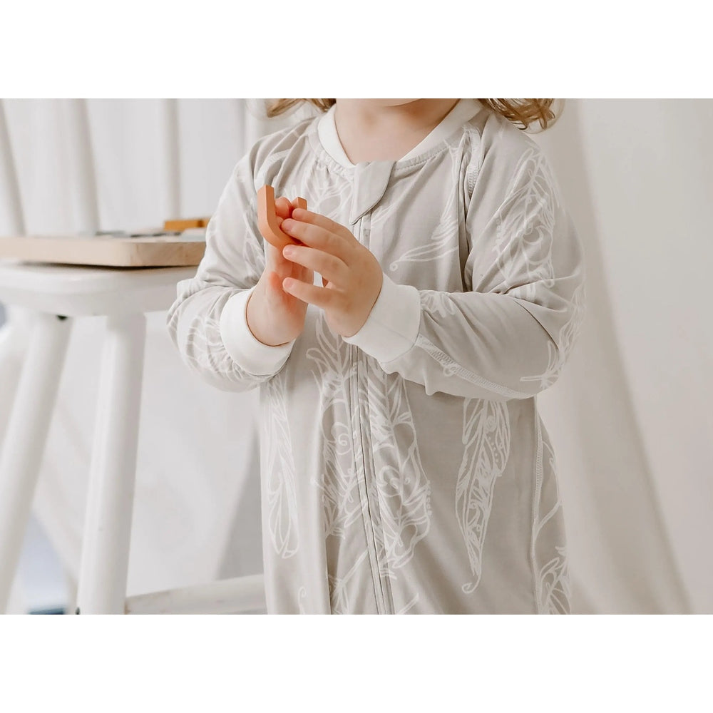 Nest Designs Zip Long Sleeve Footless Sleeper Avocado Bamboo-Feather Grey, toddler grips the front zipper.