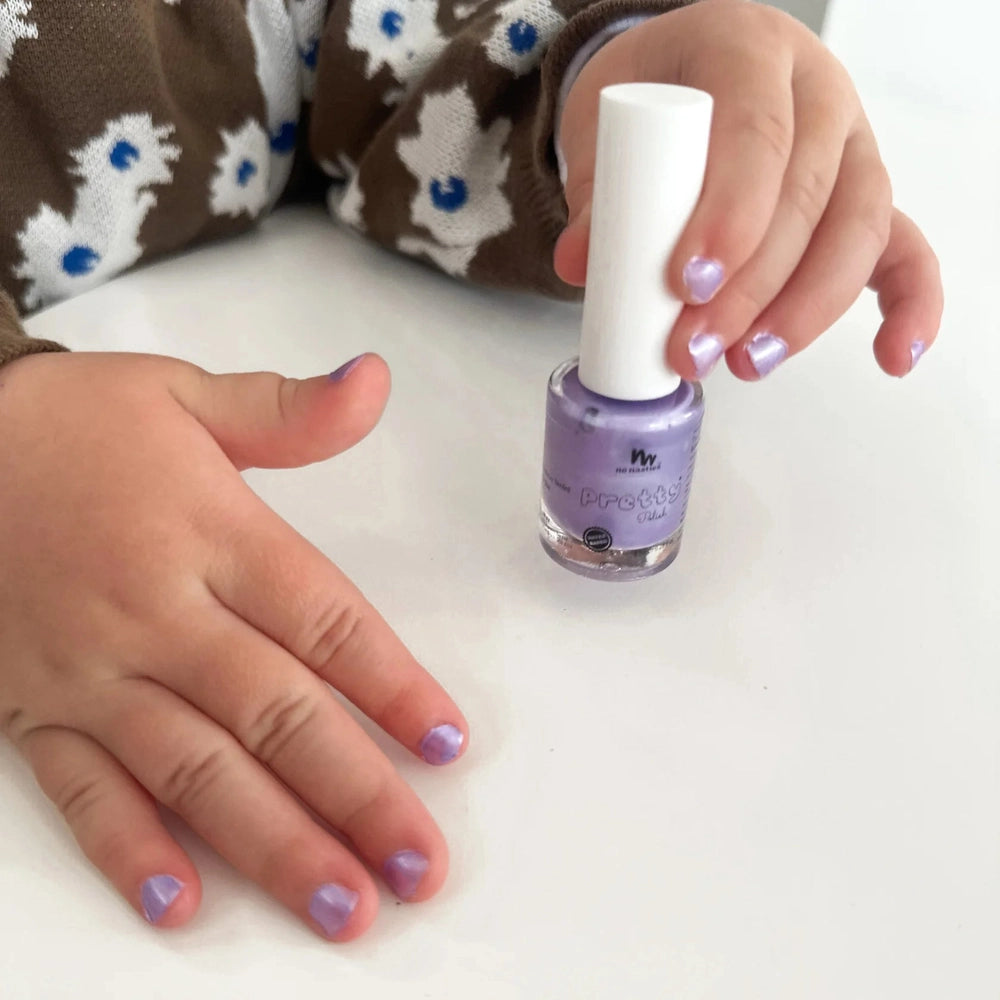 No Nasties Kids lavender purple water-based scented nail polish being applied to a child's nails