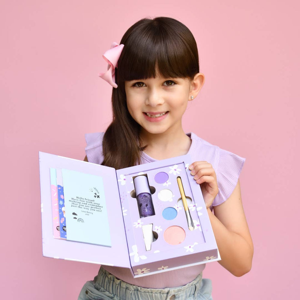 No Nasties Kids Nancy Kids Natural Pressed Powder Purple Makeup Palette Kit held by smiling girl