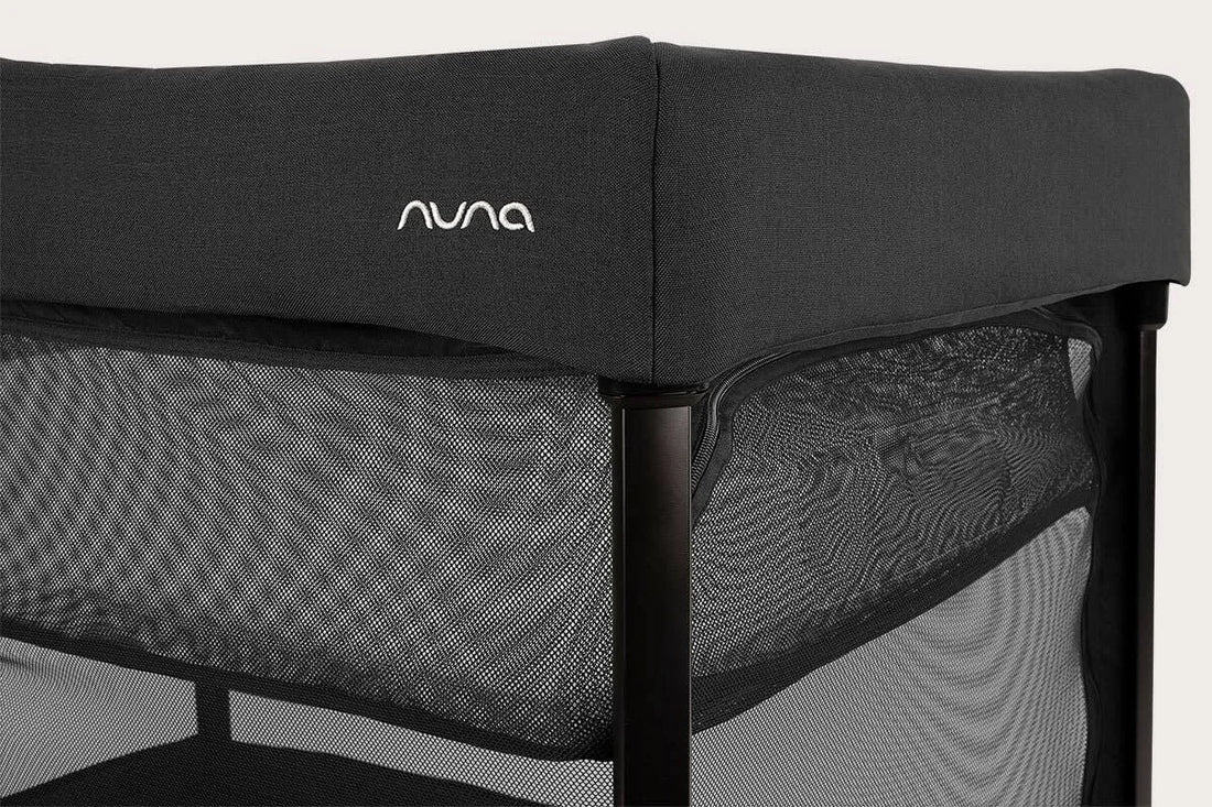 Nuna PAAL Compact Travel Playard in Caviar - padded edge and aluminum frame detail