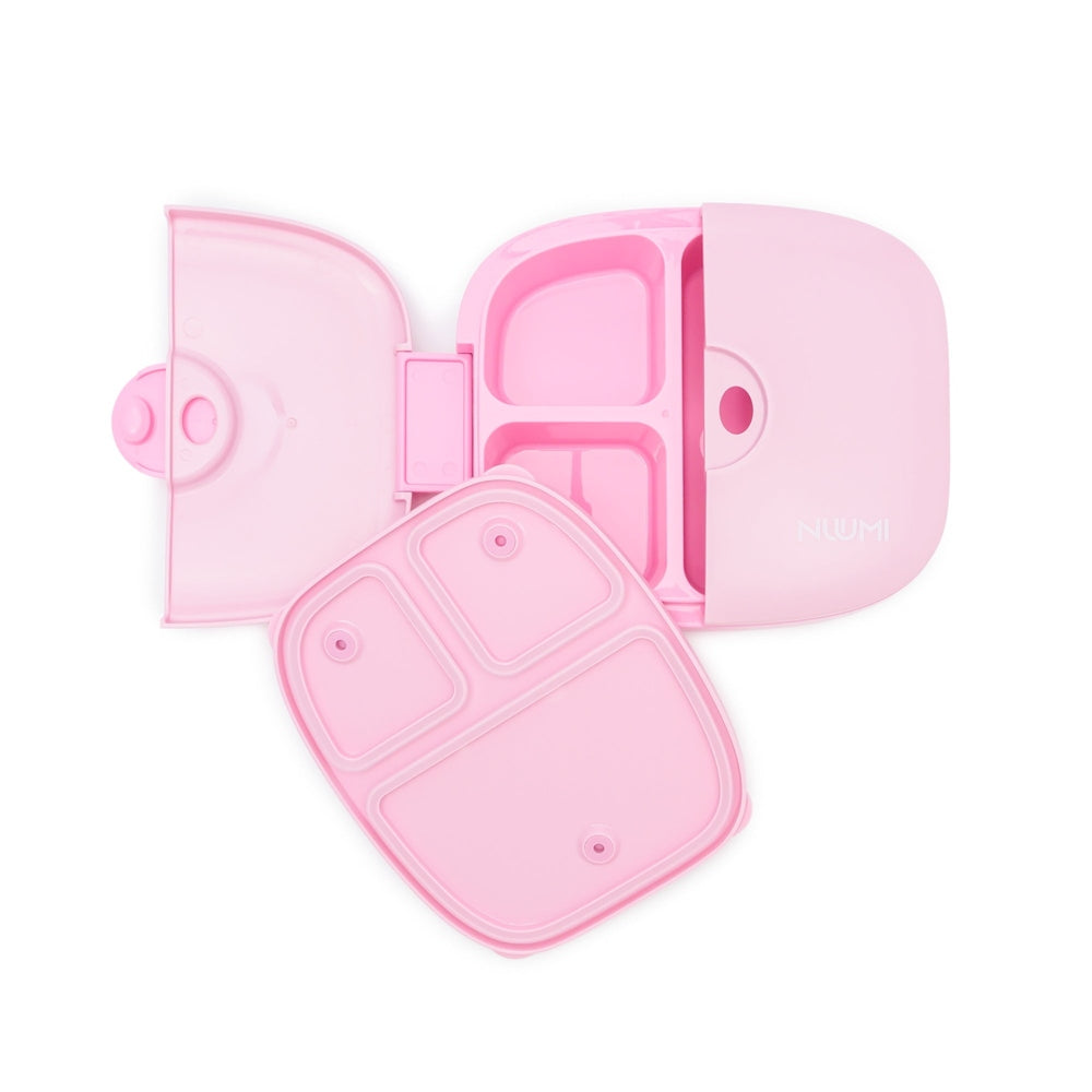 Nuumi pink lunch box with four compartments and lid, brand visible.