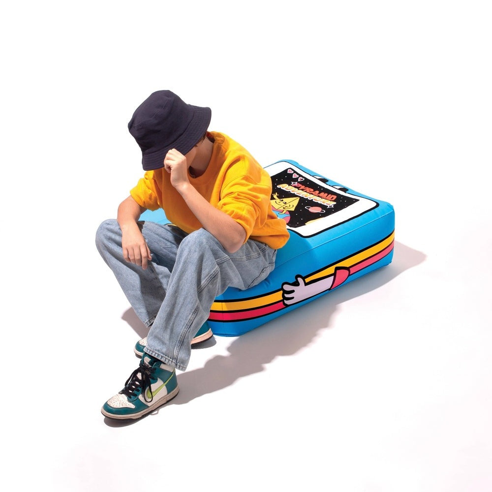 OMY Giant inflatable pillow - Video game; blue with stripes, shown with a person sitting on it.