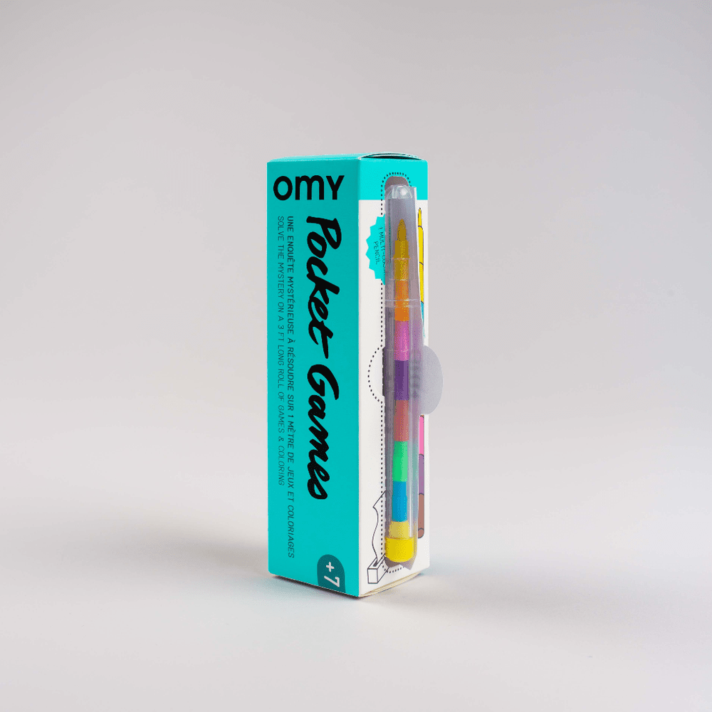 OMY Pocket Game Dino in turquoise box with rainbow markers visible, a compact coloring toy for kids.