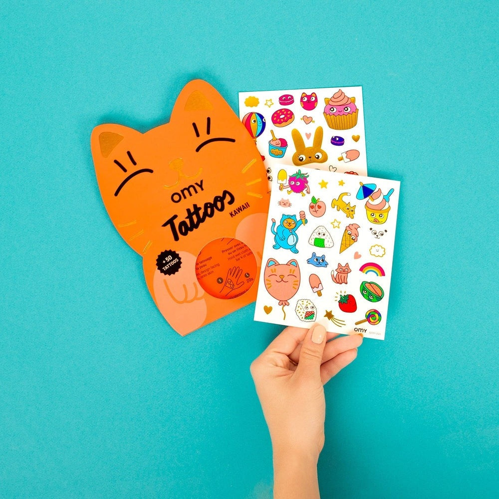 OMY Tattoos Kawaii: orange cat-shaped package held with two sheets of colorful kawaii temporary tattoo stickers.