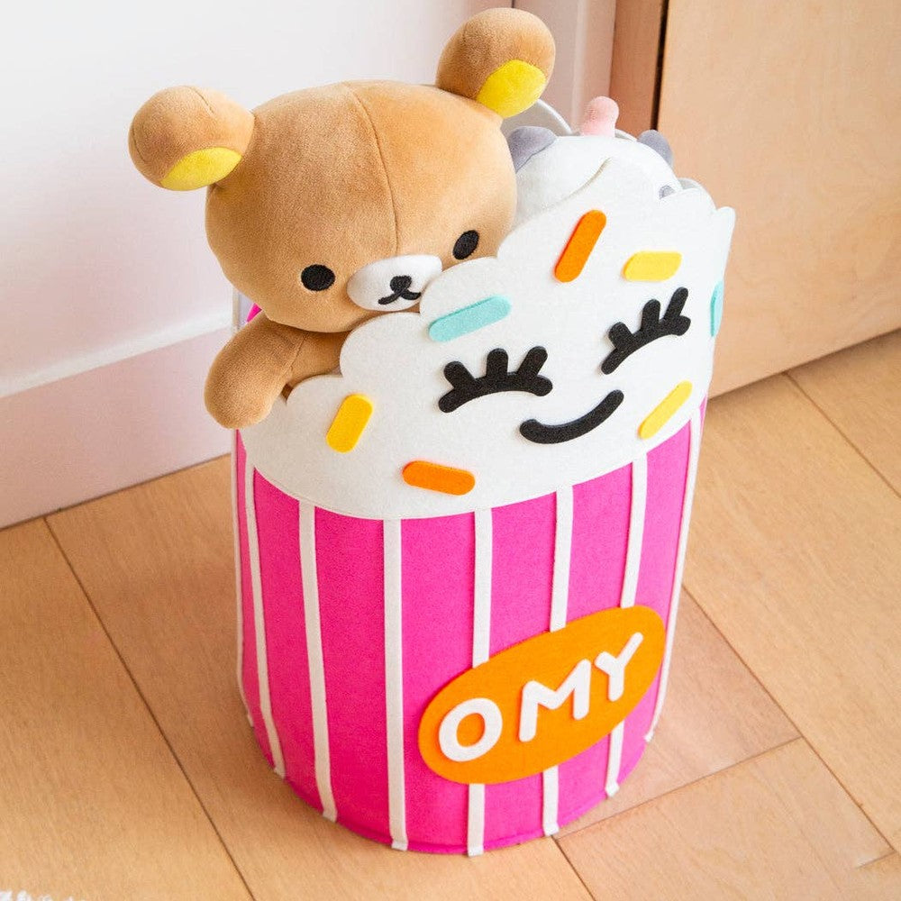 OMY - Tidy Bag - Yummy, pink striped storage bag holding a plush bear and cupcake top for easy toy organization.