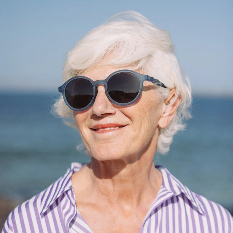 Olivio & Co oval sunglasses, navy blue frame, dark lenses for adults