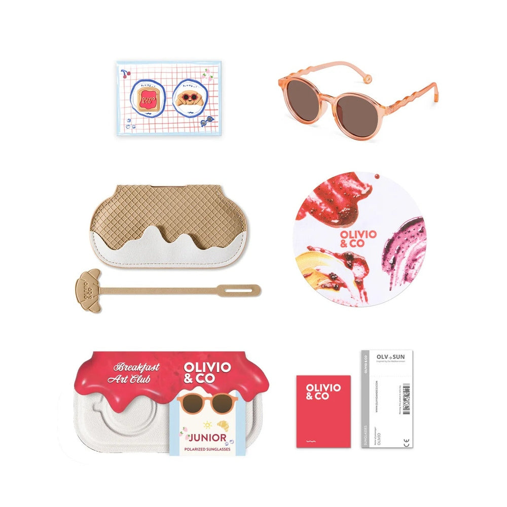 Collection of items including sunglasses, a pie-shaped case, and branded products on a white background.