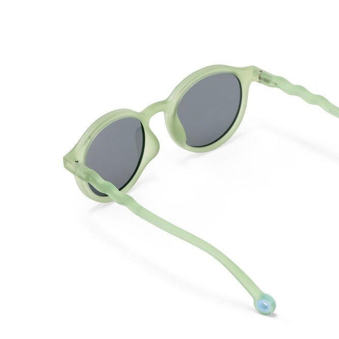 Olivio & Co Oval Sunglasses Junior in light leaf green with gray lenses, cord loops from arms with bead at end.
