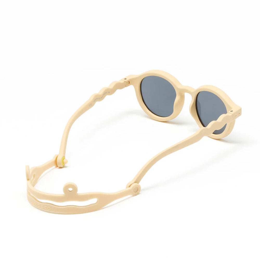 Olivio & Co kids oval sunglasses in desert sand frames with blue lenses