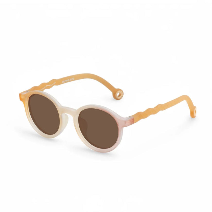 Olivio & Co oval kids sunglasses with orange waffle arms and brown lenses