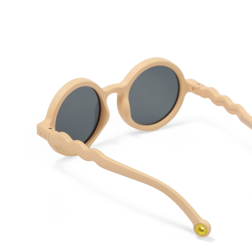 Olivio & Co round sunglasses in desert sand with dark lenses and wavy beige arms