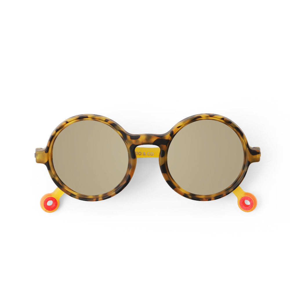 Olivio & Co Round Sunglasses for Kids in tortoiseshell with brown lenses and yellow temple tips.
