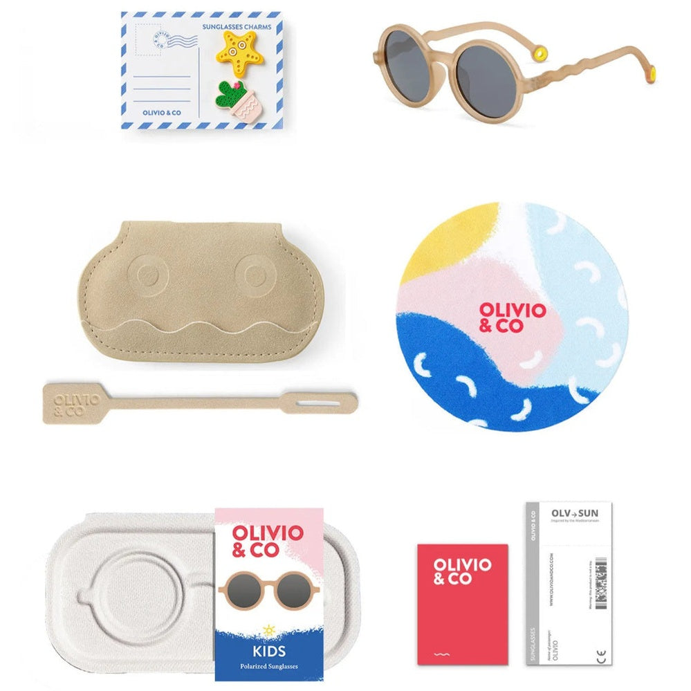 Olivio & Co Round Sunglasses Kids in sand beige, with matching beige case and included cleaning tool and round logo disk.