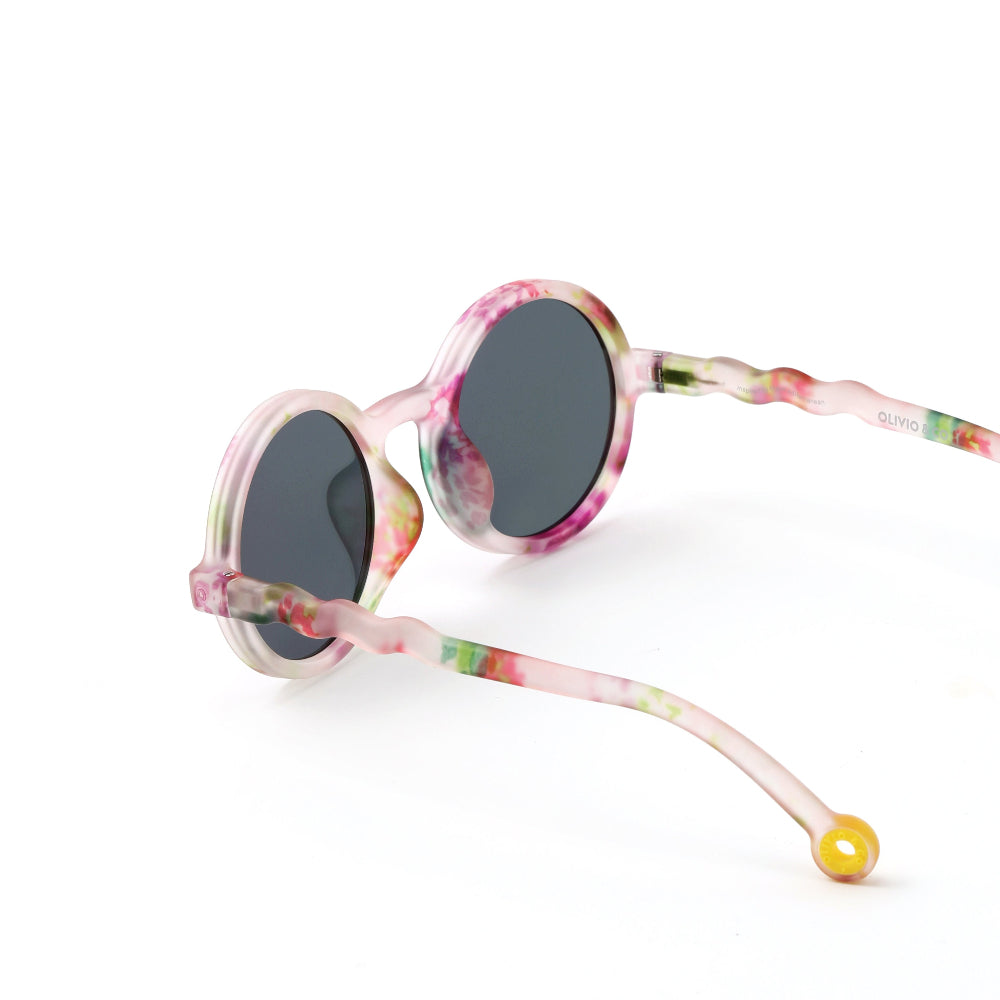 Olivio & Co Round Sunglasses Kids Wild Flower; playful pink tie-dye frame with dark round lenses.