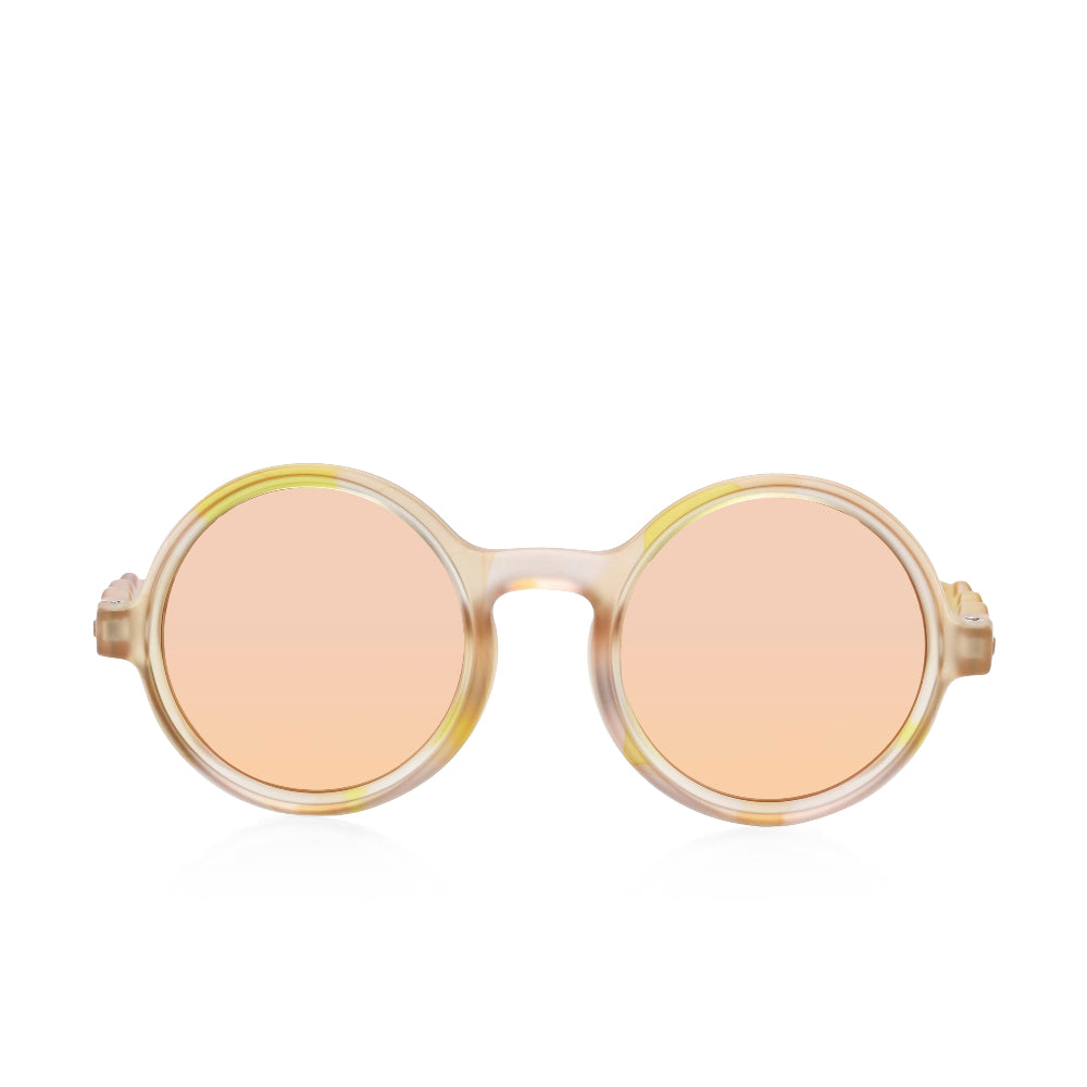 Olivio & Co round kids sunglasses in translucent Terra collage frame with peach lenses