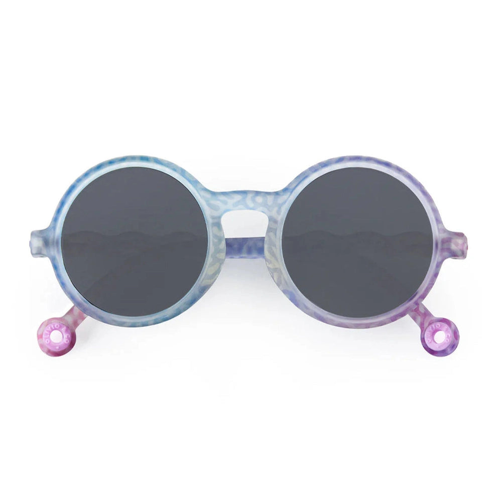 Olivio & Co round kids sunglasses in coral reef tie-dye blue-purple frame with dark lenses.